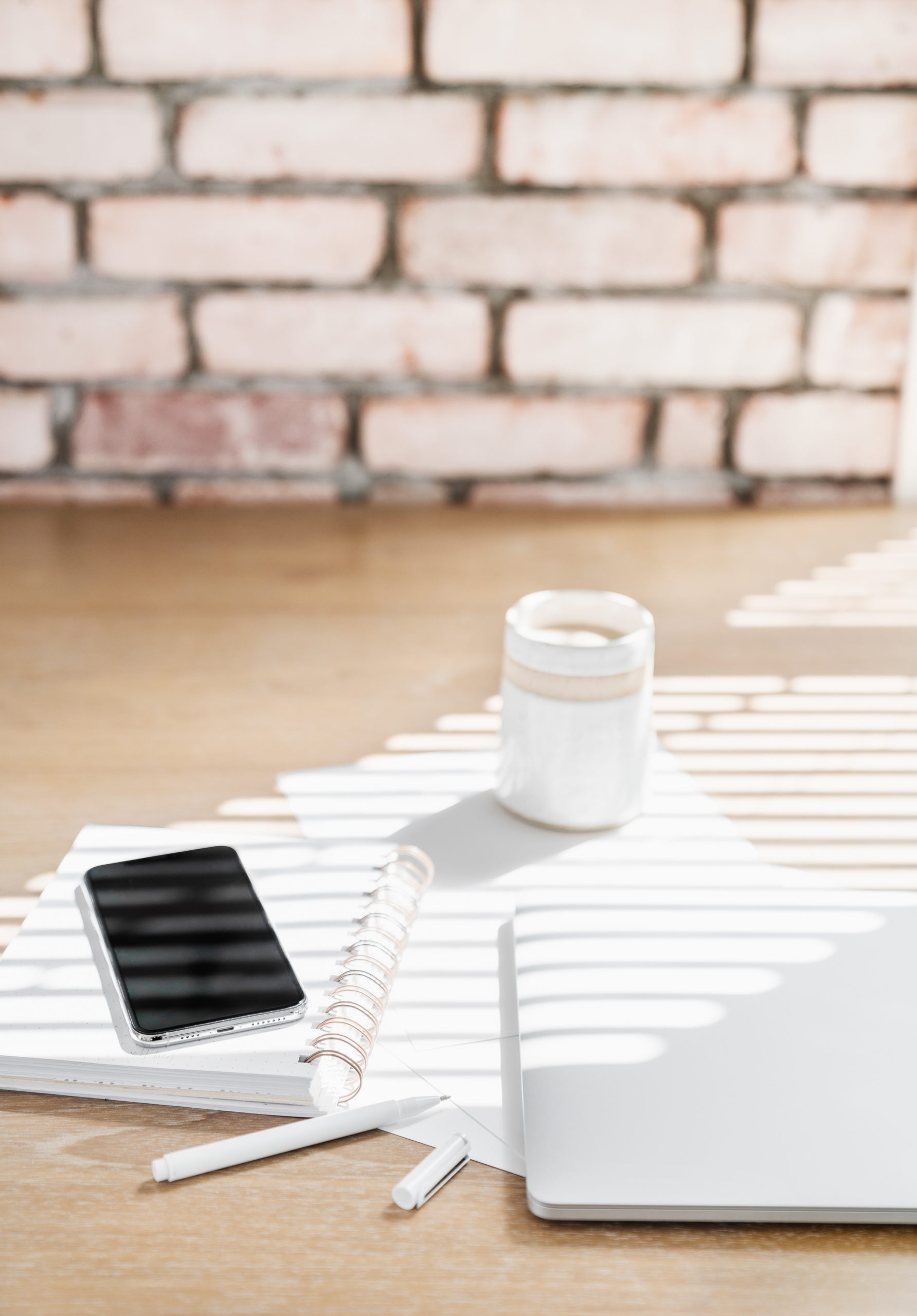 Notebook on a brick background