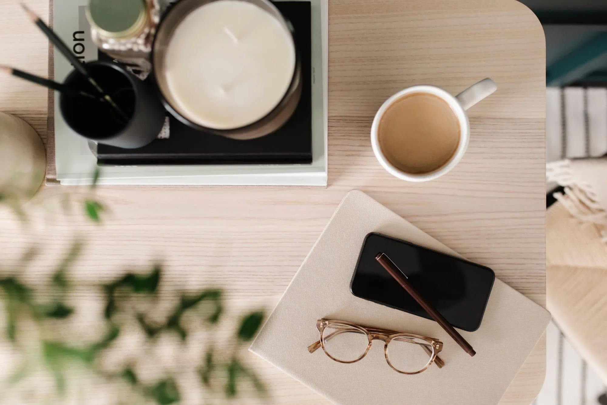 Coffee, glasses, and office supplies on a desk